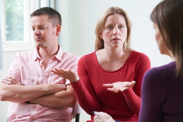 couple arguing in therapy session