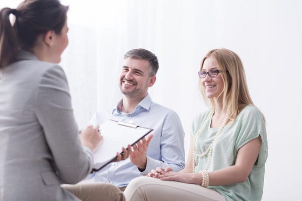 couple smiling in therapy session