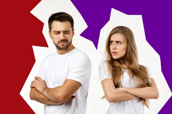 couple standing facing away from each other looking angry with arms crossed