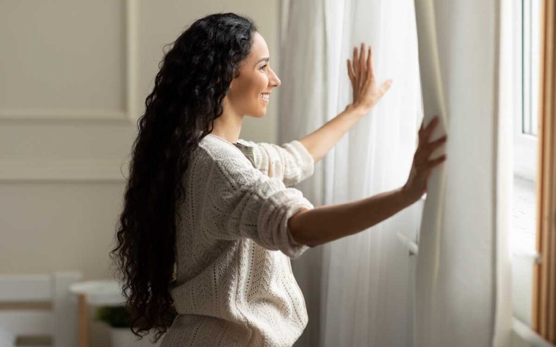 happy woman looking through window