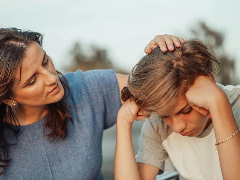 mother comforting son