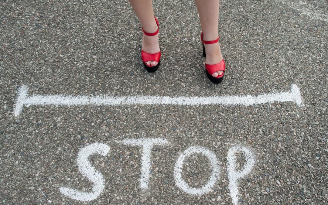 stop written on stone floor