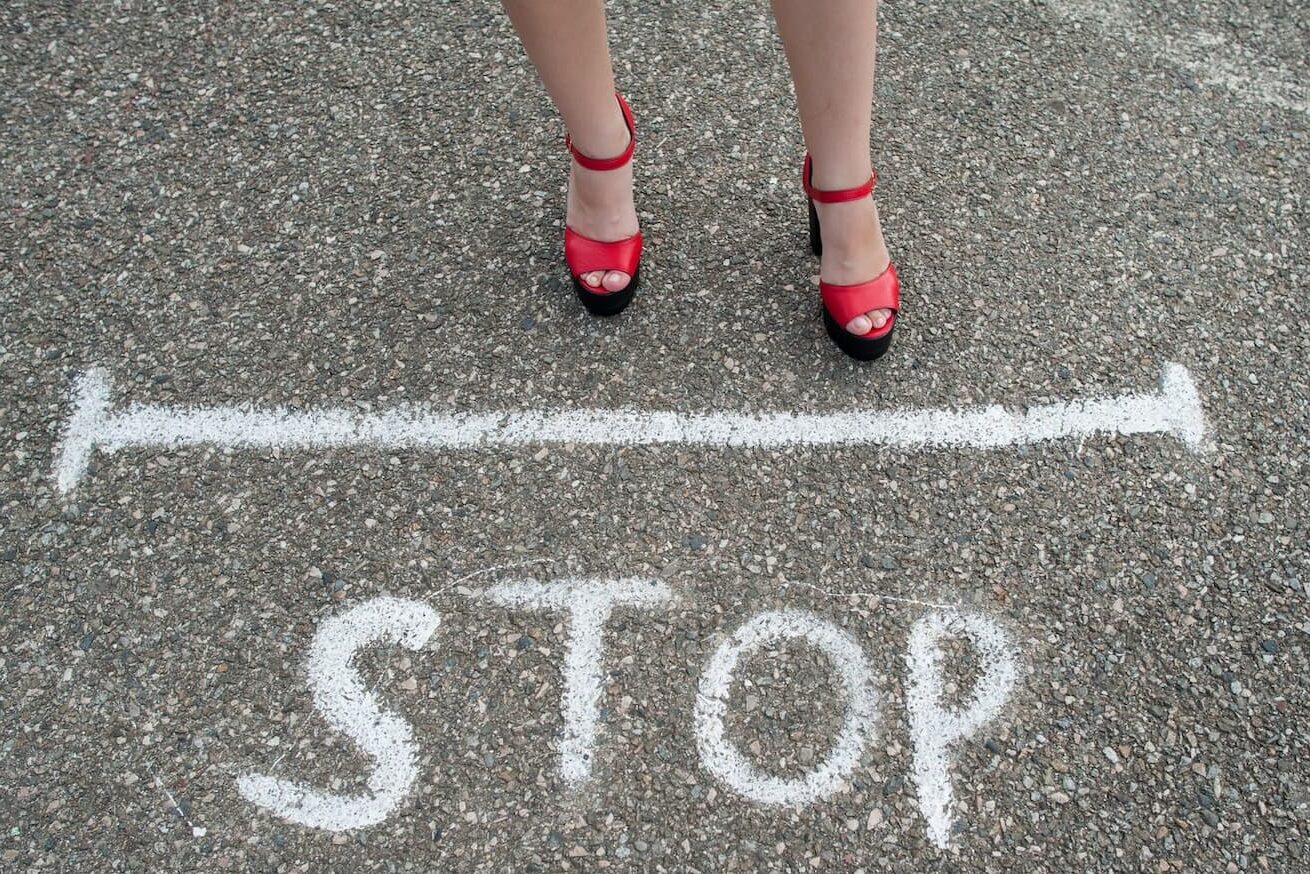 stop written on stone floor