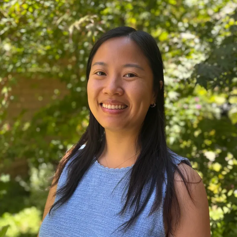 kathy phan outdoors smiling warmly